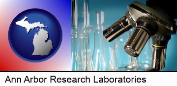 a microscope and glassware in a research laboratory in Ann Arbor, MI