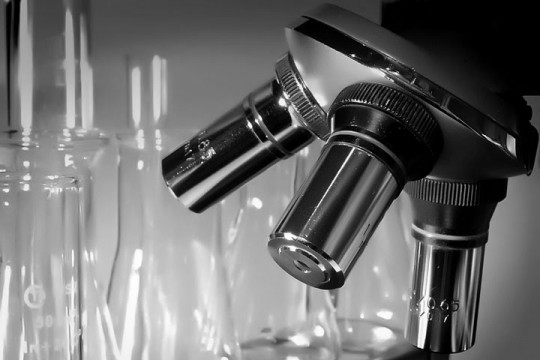 a microscope and glassware in a research laboratory