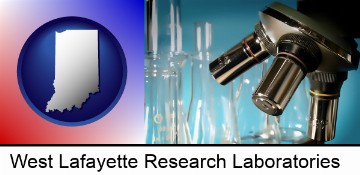 a microscope and glassware in a research laboratory in West Lafayette, IN