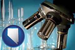 nevada map icon and a microscope and glassware in a research laboratory