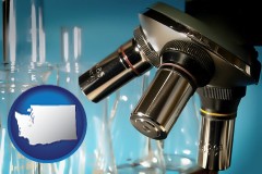 washington map icon and a microscope and glassware in a research laboratory